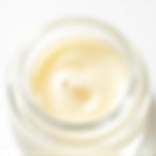 Rich organic face cream in a glass jar